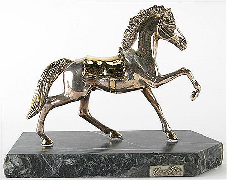"The Thoroughbred", depicting standing horse with golden saddle