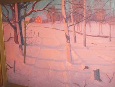 Sunset or sunrise on snowy landscape with house and barn