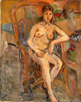 FEMME ASSISE SUR UN FAUTEUIL EN ROTIN, CIRCA 1930