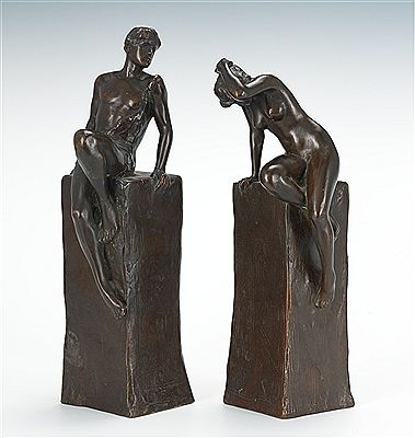 A pair of Male and Female figures seated atop pedestals (2)