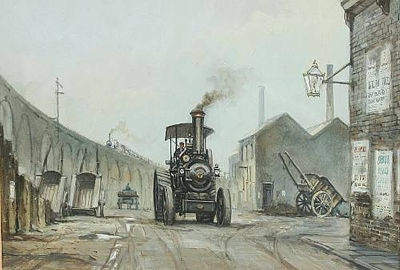 Steam truck at a Lancashire colliery with another by a railway bridge