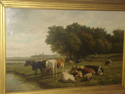 Cattle and sheep by a riverbank