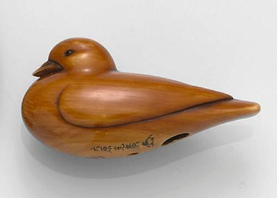 An ivory netsuke of a dove