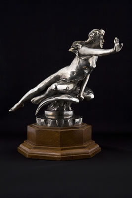 A 'Nude on Winged Wheel mascot'