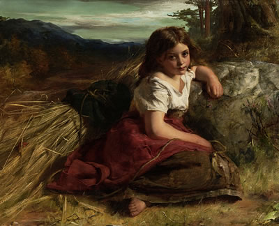 Young girl at the edge of a cornfield
