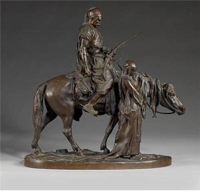 A 19th century bronze equestrian figural group of an Arab gentleman on horseback and a lady beside
