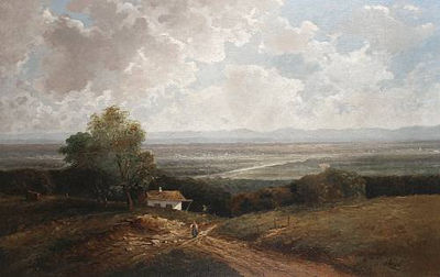 A figure on a country lane with an extensive landscape beyond