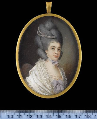 Anne, Lady de la Pole (née Templer) (1757-1832), seated on an upholstered chair, wearing frilled and layered white shawl over dress tied with mauve ribbon, strands of pearls in her powdered hair, worn high, pendent pearl earring and mauve ribbon bow at he