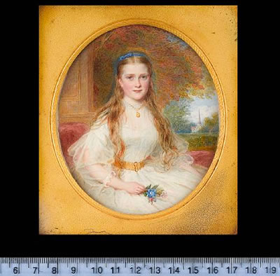 Isabella St John Callander (1847-1940), seated on a red upholstered chaise longue, wearing white dress with gauze sleeves and gold belt, blue ribbon hairband and gold locket on a necklace, she holds a posy of flowers in her lap, landscape background with by Reginald Easton - Auction record, sale price, and art valuation. Compare with similar artists and explore comparable artworks.