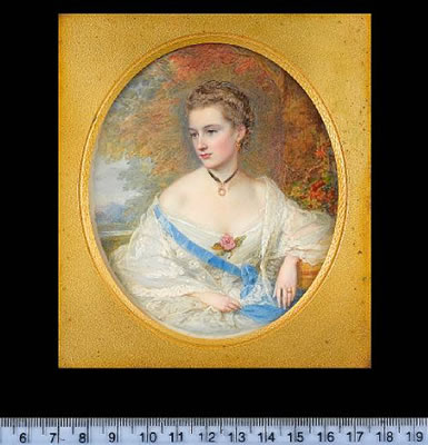 Mrs Kirkman Finlay (née Jane Callander) 'Aunt Muff' (b.1840), wearing white dress, lace shawl, pearl pendent on a black ribbon about her neck, blue purse on a ribbon worn across her chest, pink rose at her corsage and wedding ring, woodland background wit