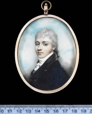 A Gentleman, wearing blue coat with black collar and brass buttons, white waistcoat, frilled chemise and stock, his powdered hair worn en queue with a black ribbon bow.