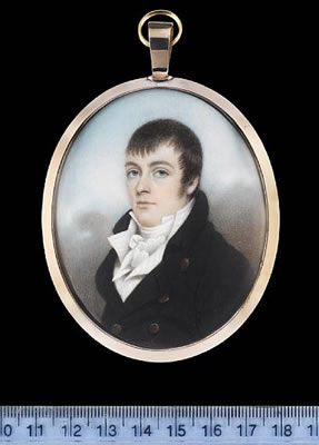 A Gentleman, wearing black coat with brass buttons, striped white waistcoat, frilled chemise and tied stock.