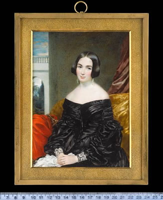 A Lady, seated, wearing black dress with puffed sleeves and white lace cuffs, pendent glass drop earrings and wedding ring, she holds a white handkerchief, a vermillion mantle with embroidered border over the arm of her chair, crimson curtain, balustrade
