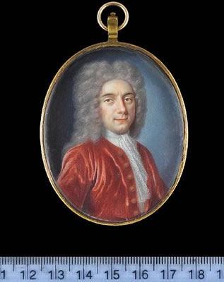 A Gentleman, wearing crimson coat, white lace cravat and powdered wig.