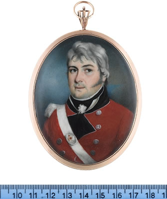 An Officer of an Auxiliary Infantry, wearing red coat with white piping to the black facings and standing collar, silver buttons, white epaulette, white cross belt with oval gilt-metal belt plate, white frilled chemise and black stock.