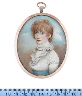 A Lady, wearing white dress with frilled lace collar, sky blue sash, a white neck scarf tied tightly around her neck, her blonde hair upswept and curled.