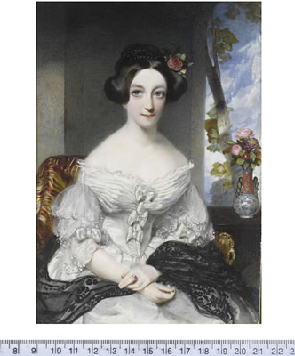A Lady, seated in an interior before a window, wearing white dress with lace trim and tiered lace sleeves, folded detailing at the bust