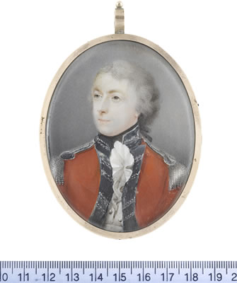 An Officer, wearing red coatee with dark blue facings, standing collar and passants, silver lace and epaulettes, white waistcoat and frilled chemise, black stock, his powdered hair tied with a black ribbon bow.
