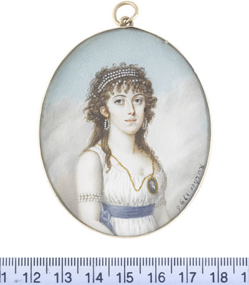A Lady, wearing white sleeveless dress, blue sash, strands of pearls wrapped around her upper arms, pearl hoop earrings and strands of pearls in her l
