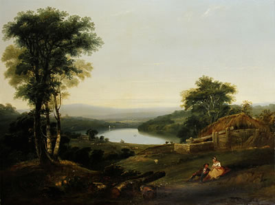 Extensive wooded landscape with cottage beyond