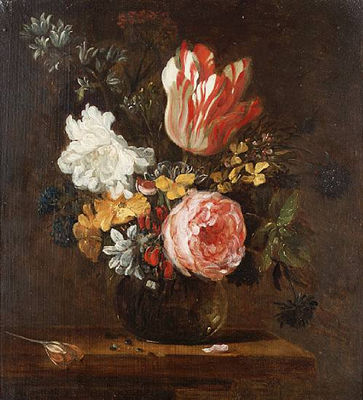 A parrot tulip, roses, hyacinths and other flowers in a glass vase on a wooden table