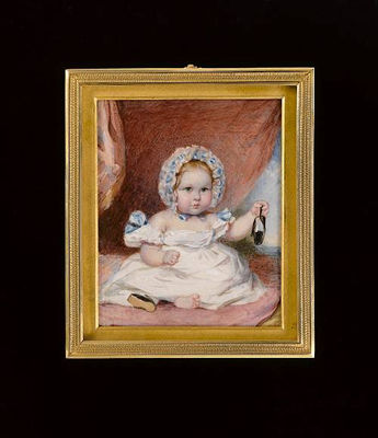 A young Child, seated on a pink cushion, holding a black slipper