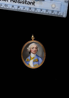 A Gentleman, wearing pale blue coat over white waistcoat, both trimmed with gold embroidery and button holes, white stock, his powdered wig worn en queue tied with a black ribbon bow