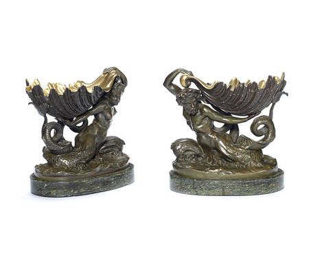 A pair of gilt and patinated bronze groups of trytons holding shells