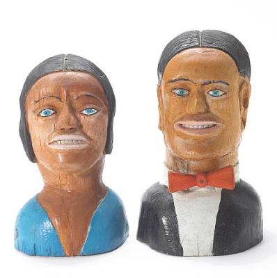 Two carved and polychromed wood heads of a man and woman