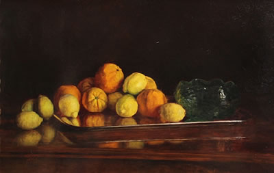 A still life with lemons, oranges and a glass bowl