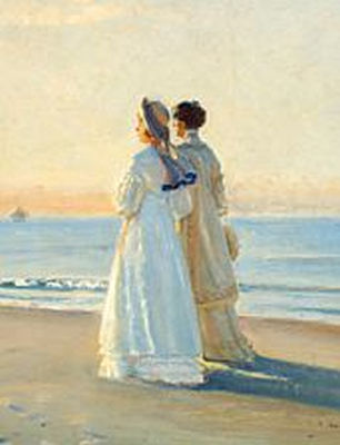 Two ladies in the sunset at Skagen Nordstrand (Skagen Beach).
