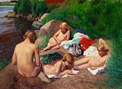 After the swim. Girls sunbathing in the grass at the sea between Fåborg and Dyreborg, Funen.