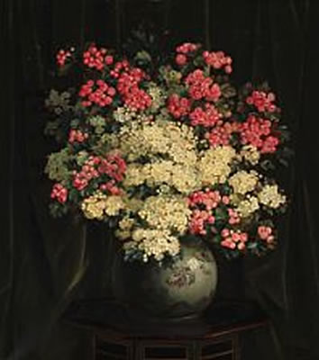 Red and white hawthorn branches in a Japanese vase on a table