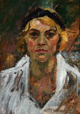 Portrait of woman with a black hair band.