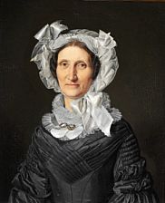 An elegant woman in a black dress and a white bonnet with bows.