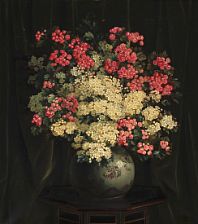 Red and white hawthorn branches in a Japanese vase on a table
