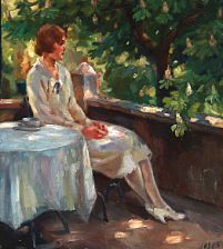 A woman sitting on a balcony.