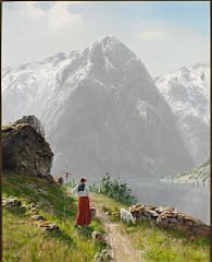 Norwegian fiord landscape with a young girl and a goat, summer