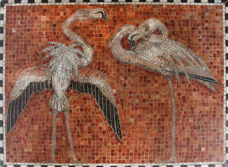 A large stone mosaic decorated with motif in the shape of flamingos