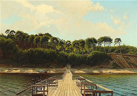 A jetty with a forrest in the background