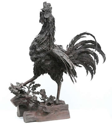 Crowing rooster on a trunk
