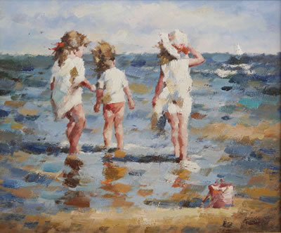 Drie meisjes pootjebadend in de zee