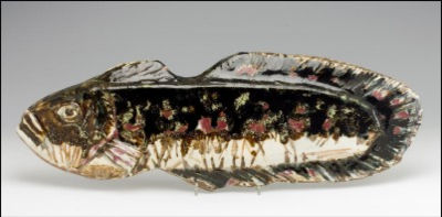 A CERAMIC WALL RELIEF. A fish