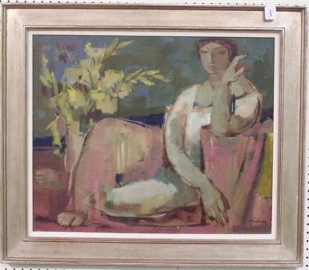 Seated woman next to flowers