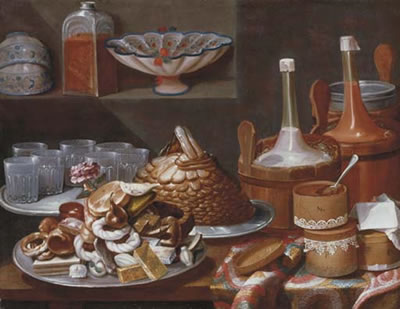 Cakes, bread, fruit, a rose, savoiardi biscuits and glasses on pewter plates with bottles in pails and decorated boxes on a partly draped table, white and blue porcelain cups and bowls with a glass jar on a ledge