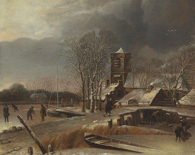 Winter landscape with skaters on a frozen canal