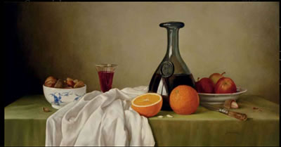 Still Life of fruit, wine and a bowl of nuts on a draped table