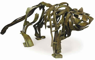 AN AMERICAN PATINATED-BRONZE MODEL OF A STRIDING CAT