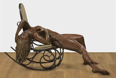 WOMAN ON A ROCKING CHAIR
