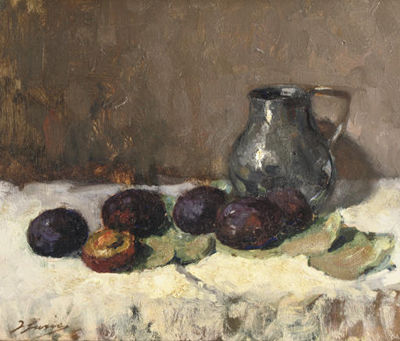 Prunes and a jug on a table